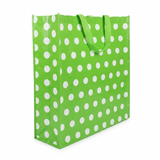 Green tote bag with white polka dots on a white background