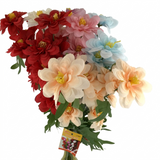 Bouquet of artificial Dahlia flowers in red, pink, blue, and peach colors on a white background.