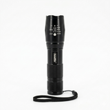 Black flashlight with a strap on a white background