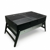 Black portable grill on a white background